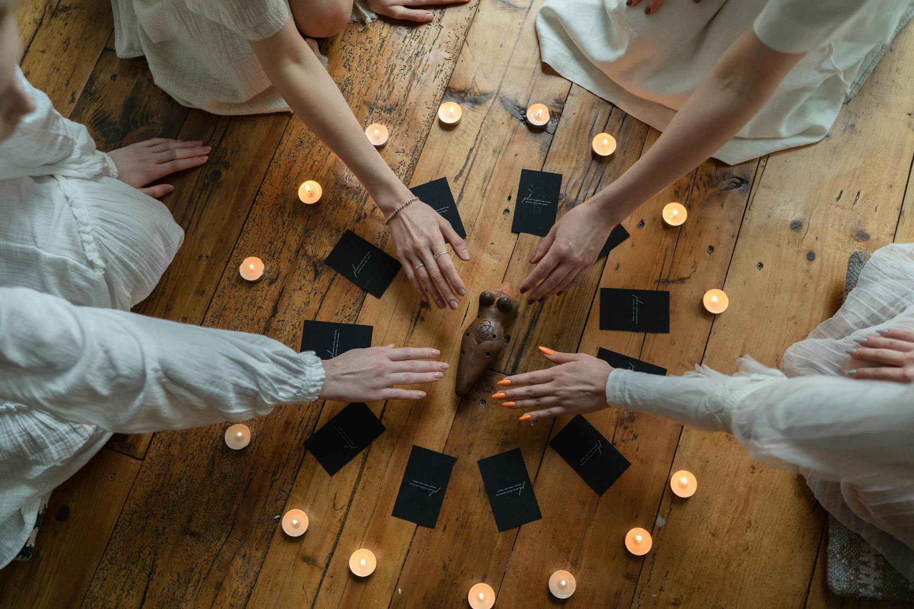 people holding black and brown cards