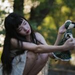 girl holding a doll